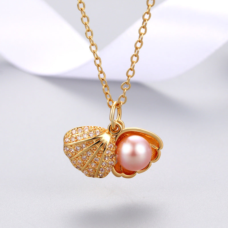 "Shell Freshwater Pearl Necklace β A delicate pendant featuring a 7-8mm freshwater pearl, available in various styles with white gold or gold supports. Elegant and timeless, perfect for adding sophistication to any occasion."