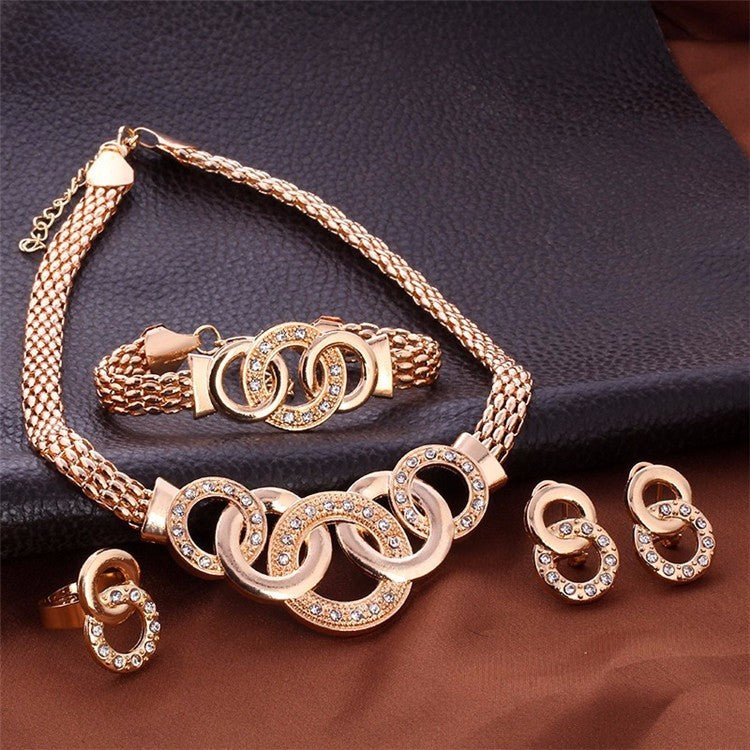 4-piece couple-style jewelry gift set featuring rhinestone earrings, hand accessories, and item accessories with alloy inlaid artificial gems and semi-precious stones. Includes a stylish horsewhip chain.
