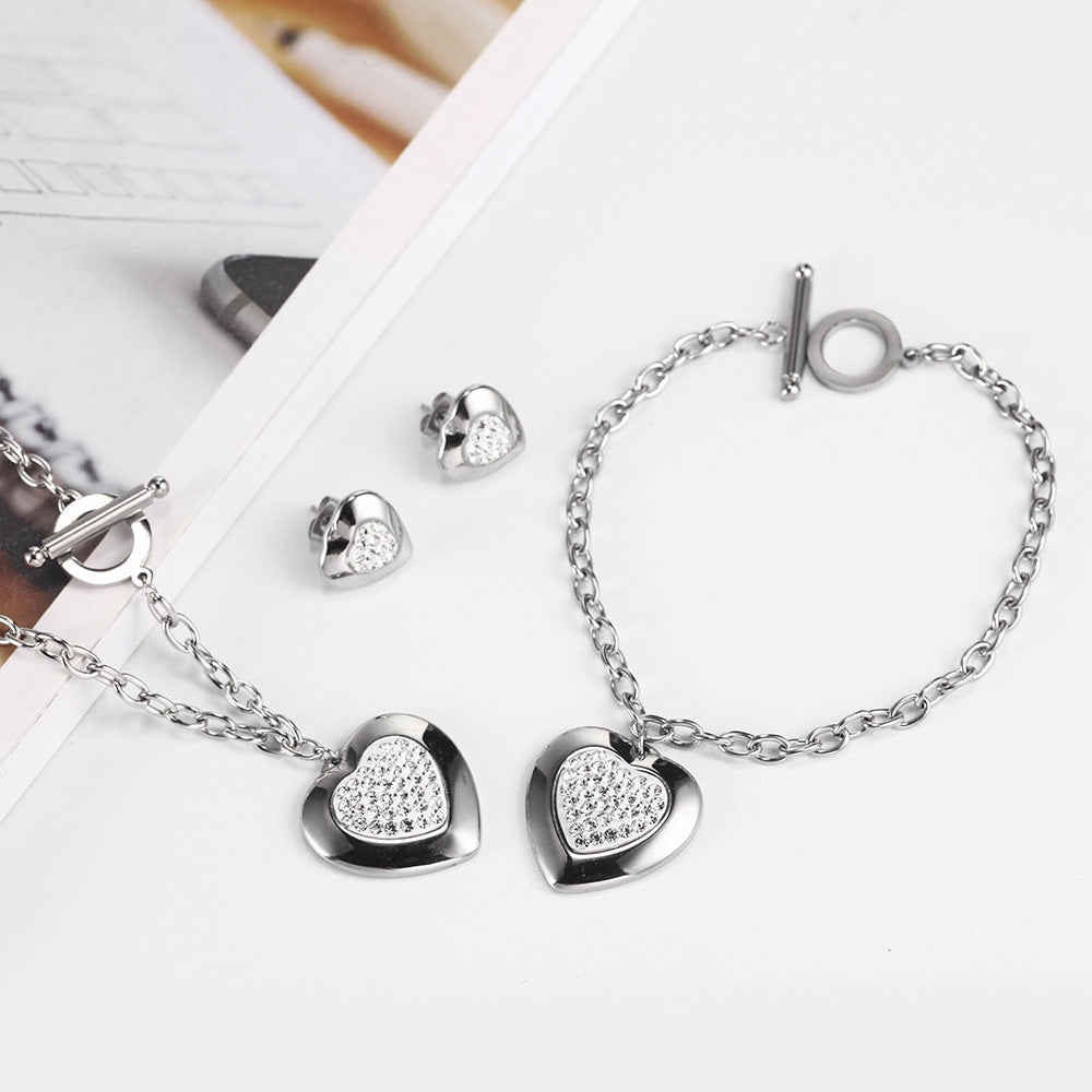 Heart-Shaped Rhinestone Jewelry Set made of titanium steel, featuring a necklace (45cm) and bracelet (20cm) with manual polishing. Available in steel color and gold.