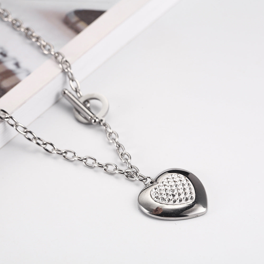 Heart-Shaped Rhinestone Jewelry Set made of titanium steel, featuring a necklace (45cm) and bracelet (20cm) with manual polishing. Available in steel color and gold.