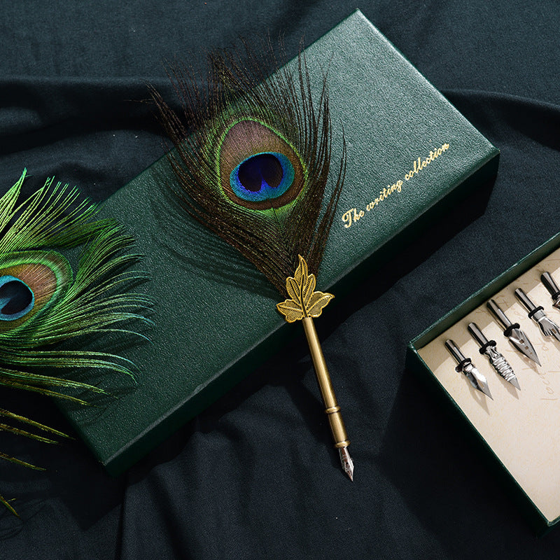 Retro Peacock Feather Pen Set featuring a 25cm feather pen, ink bottle, base with double-sided adhesive, and 5 replacement nibs, all packaged in a sleek 29 * 11.5 * 4CM box.