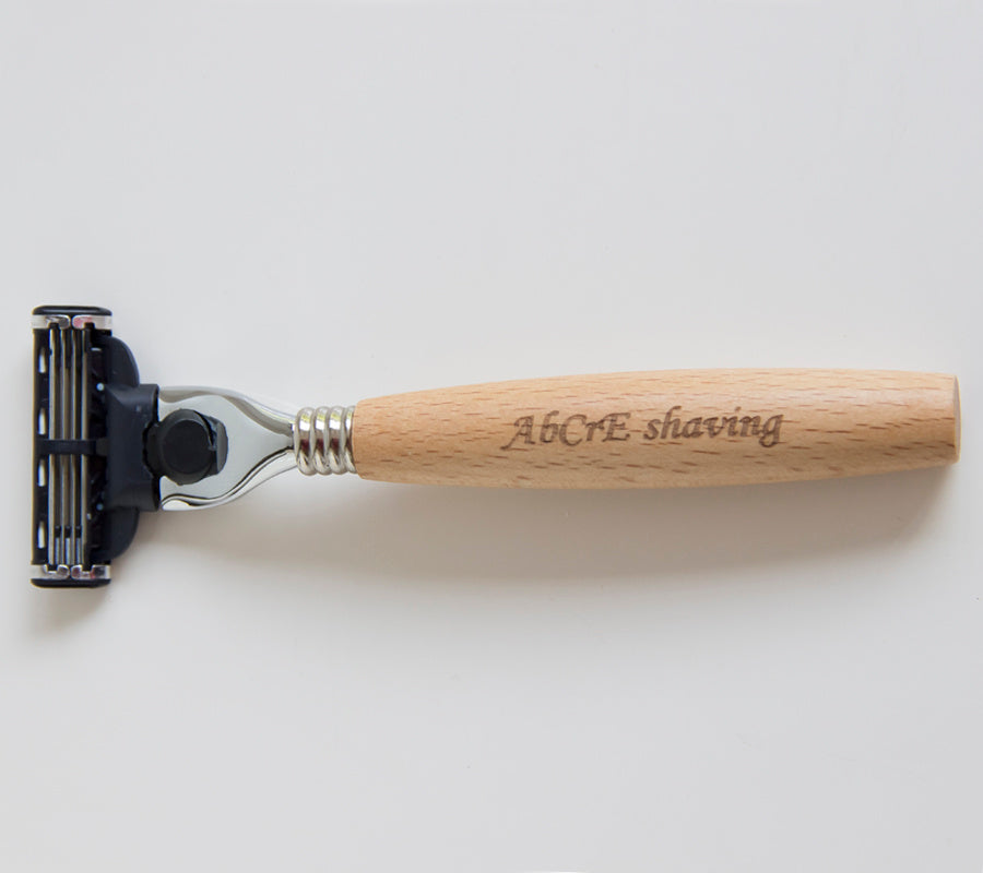 Men's shaving set featuring a metal brush and razor holder made of Fe-Ni alloy, a stainless steel double-layer shaving soap bowl, a 3-layer imported blade razor with a wooden handle, and a bristles shaving brush made from natural bristles. Available in two styles: one with a spare blade and another with two spare blades.