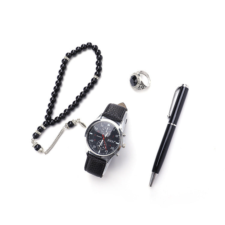 A chic boutique gift set featuring a stylish watch, a rosary, a ring, and a sleek pen, all presented in elegant black and brown color options.