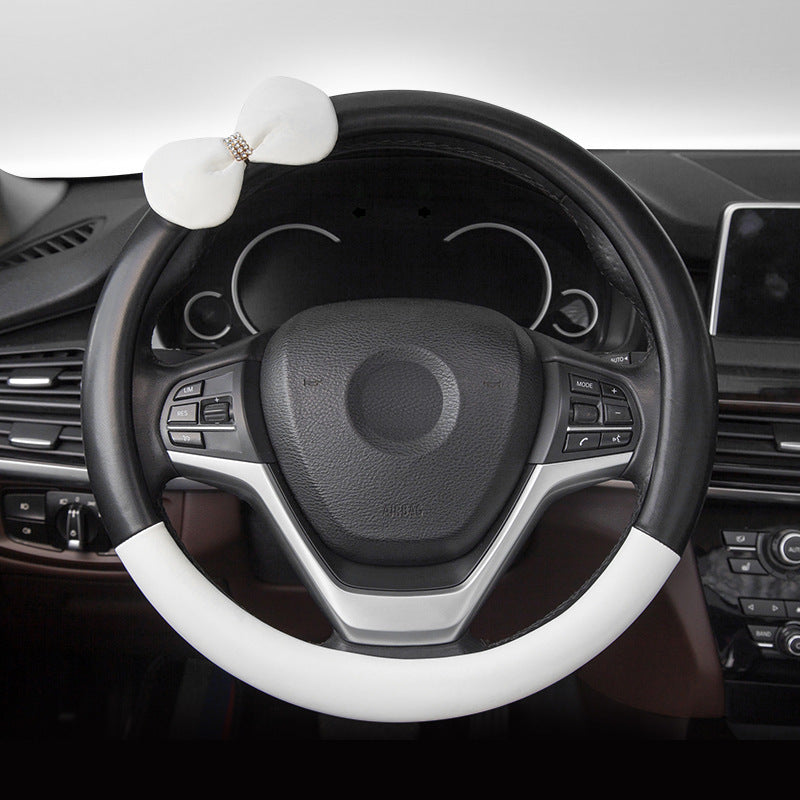 Cute microfiber leather car steering wheel cover, designed for comfort and style. Fits 95% of vehicle models with a size of 38.0 cm x 38.0 cm x 4.0 cm.