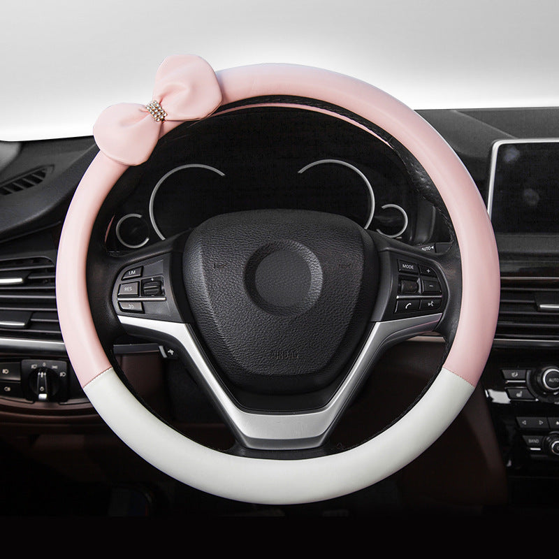 Cute microfiber leather car steering wheel cover, designed for comfort and style. Fits 95% of vehicle models with a size of 38.0 cm x 38.0 cm x 4.0 cm.