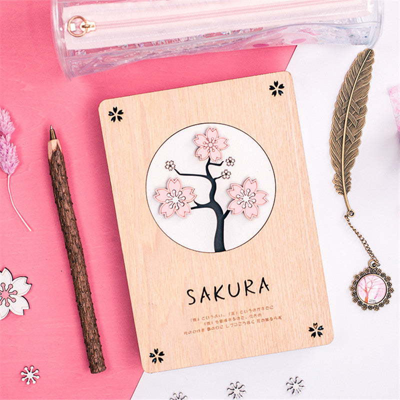 Creative Sakura Notebook Set with carved wooden cover, eco-friendly paper, and crystal bookmark.