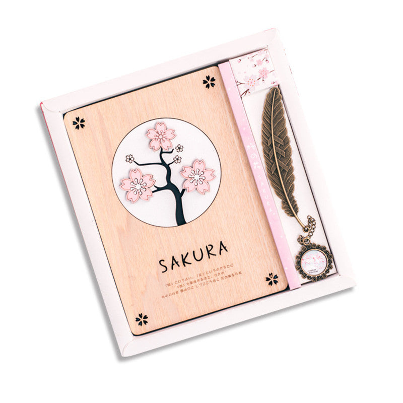 Creative Sakura Notebook Set with carved wooden cover, eco-friendly paper, and crystal bookmark.