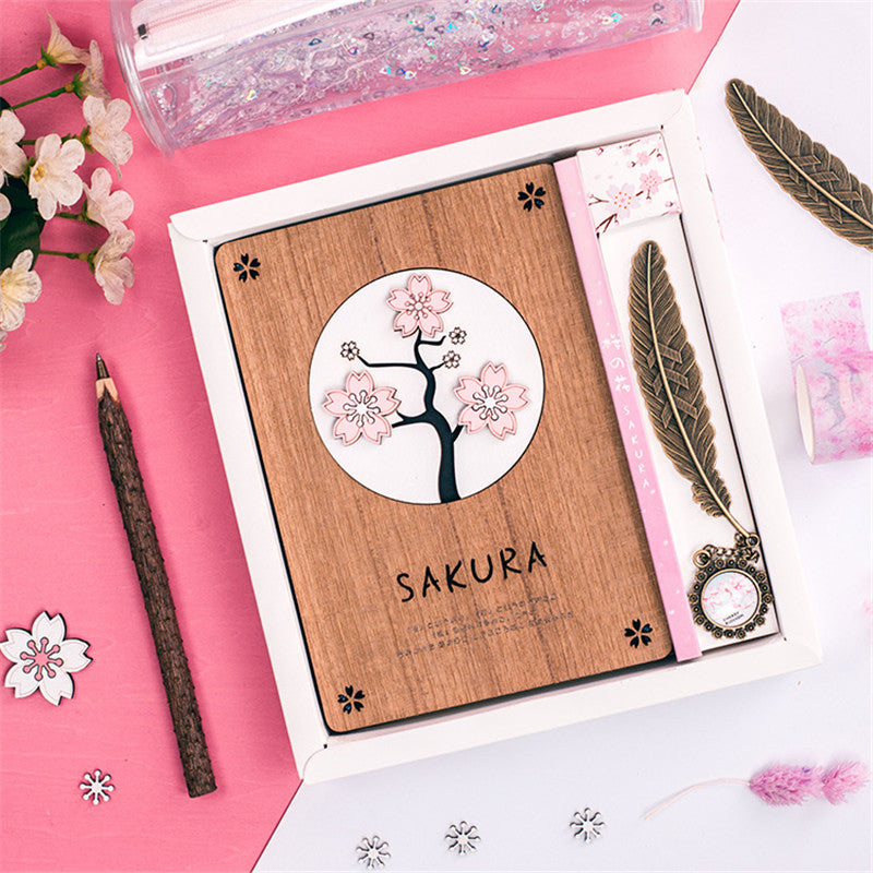 Creative Sakura Notebook Set with carved wooden cover, eco-friendly paper, and crystal bookmark.