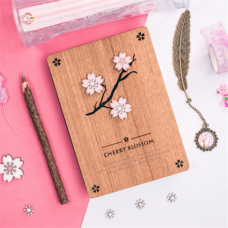 Creative Sakura Notebook Set with carved wooden cover, eco-friendly paper, and crystal bookmark.