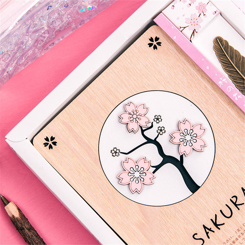 Creative Sakura Notebook Set with carved wooden cover, eco-friendly paper, and crystal bookmark.
