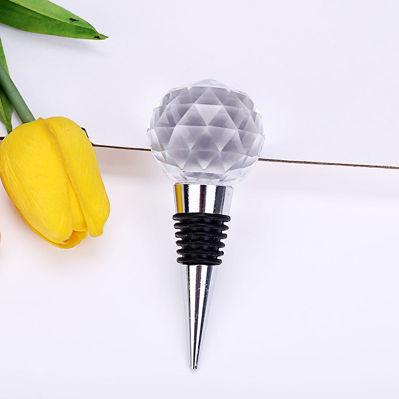 "Crystal Ball Wine Stopper β A stylish silver wine stopper made from metal with a beautiful crystal ball top, designed to keep your wine fresh while adding an elegant touch to your bottle."