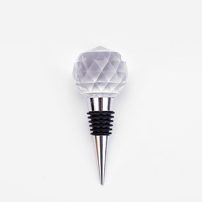 "Crystal Ball Wine Stopper β A stylish silver wine stopper made from metal with a beautiful crystal ball top, designed to keep your wine fresh while adding an elegant touch to your bottle."