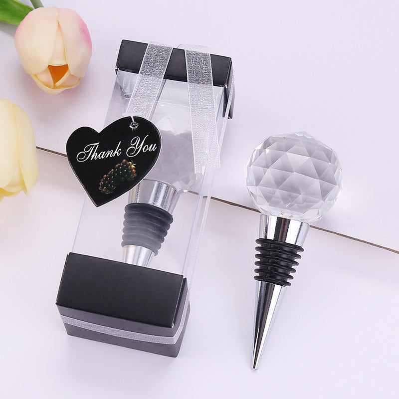 "Crystal Ball Wine Stopper β A stylish silver wine stopper made from metal with a beautiful crystal ball top, designed to keep your wine fresh while adding an elegant touch to your bottle."