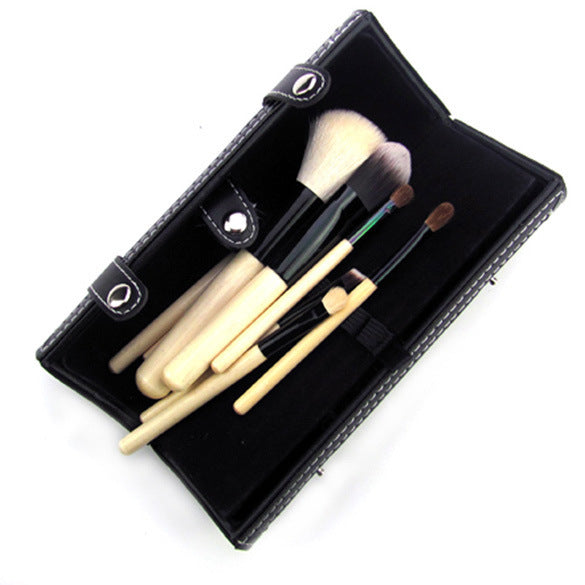 9-piece Barrel Makeup Brush Set featuring a variety of brushes for powder, foundation, eyeshadow, lips, and eyebrows, crafted with high-quality bristles for precise application.