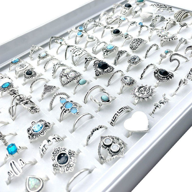 A stylish set of 100 fashion-forward silver alloy rings featuring geometric designs, perfect for adding a trendy touch to any outfit. Each set offers a random selection of styles, ensuring variety and versatility.