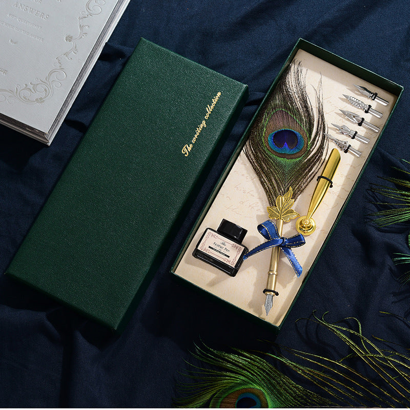 Retro Peacock Feather Pen Set featuring a 25cm feather pen, ink bottle, base with double-sided adhesive, and 5 replacement nibs, all packaged in a sleek 29 * 11.5 * 4CM box.