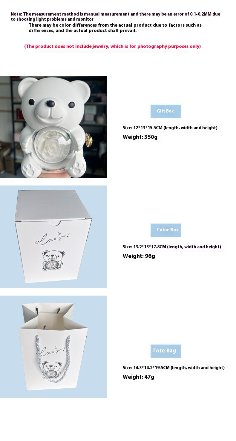 **Rotating Bear Gift Box β Playful & Elegant Packaging π** A **plastic jewelry box** with a **rotating bear design** and **preserved plastic flowers**, perfect for gifting jewelry. Measures **12x13x15.5cm**. Adds charm to your special present! π