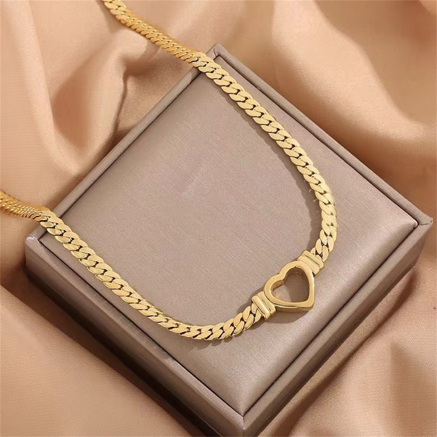 **Love Necklace & Bracelet** – Elegant **heart-shaped jewelry** with a sleek **Cuban chain**. Made from **stainless steel** with an **electroplated finish**, it's stylish, durable, and comfortable to wear. Perfect for any occasion or as a heartfelt gift. 💖