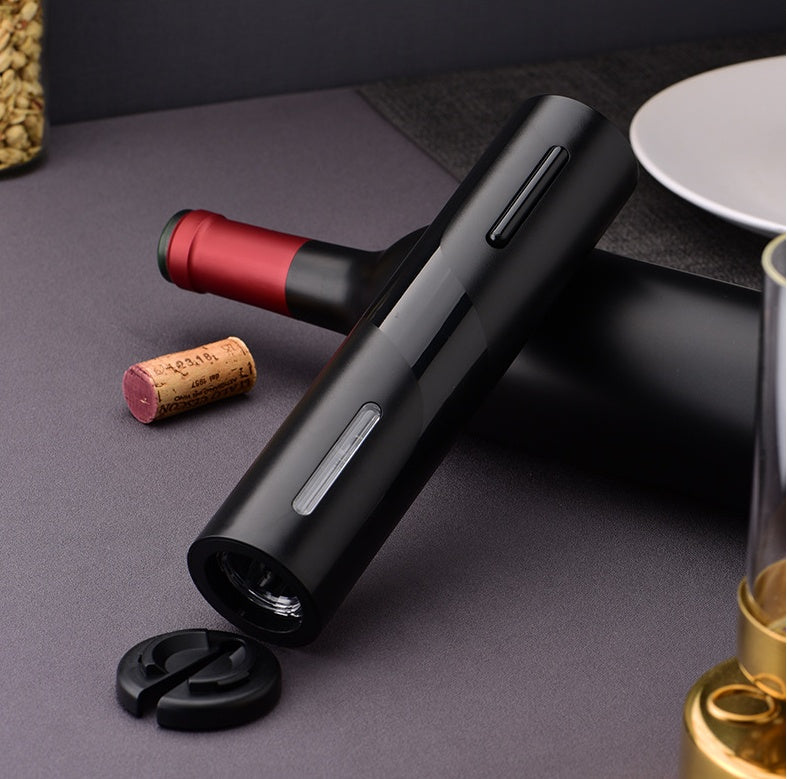 Five-in-One Electric Bottle Opener Set featuring a decanter, paper cutter, pull-out vacuum plug, USB cable, and storage box, all made with durable ABS plastic. A sleek, modern design ideal for various gift-giving occasions.