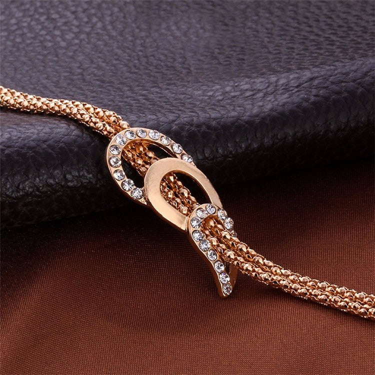 4-piece couple-style jewelry gift set featuring rhinestone earrings, hand accessories, and item accessories with alloy inlaid artificial gems and semi-precious stones. Includes a stylish horsewhip chain.