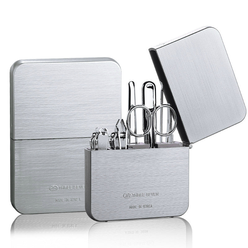 Nail clippers set made of carbon steel, including a diagonal cut clipper, flat cut clipper, dead skin shovel, nail file, eyebrow clip, ear pick, and eyebrow scissors for complete grooming.