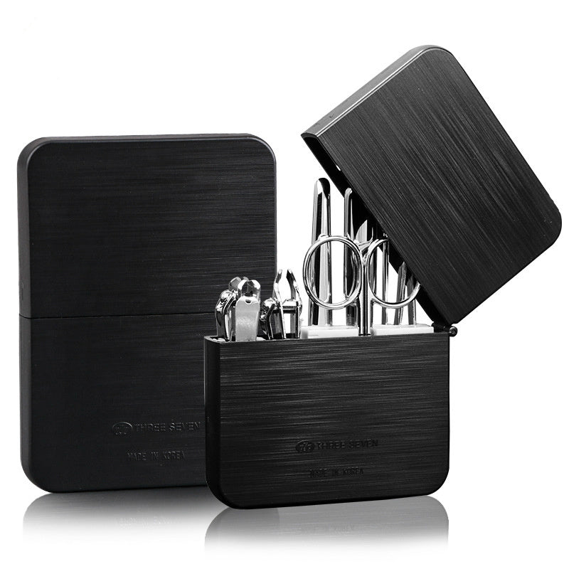 Nail clippers set made of carbon steel, including a diagonal cut clipper, flat cut clipper, dead skin shovel, nail file, eyebrow clip, ear pick, and eyebrow scissors for complete grooming.