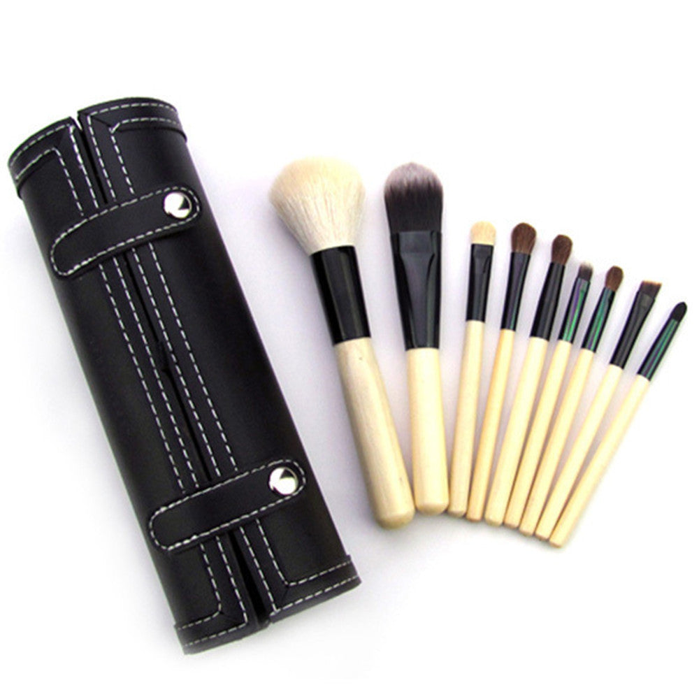 9-piece Barrel Makeup Brush Set featuring a variety of brushes for powder, foundation, eyeshadow, lips, and eyebrows, crafted with high-quality bristles for precise application.