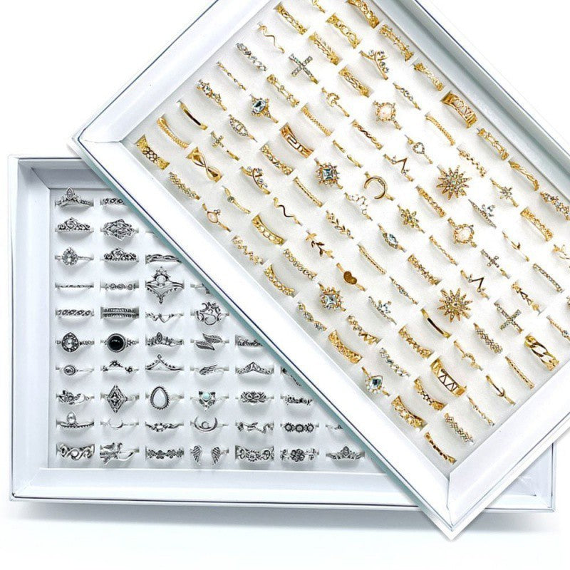 A stylish set of 100 fashion-forward silver alloy rings featuring geometric designs, perfect for adding a trendy touch to any outfit. Each set offers a random selection of styles, ensuring variety and versatility.