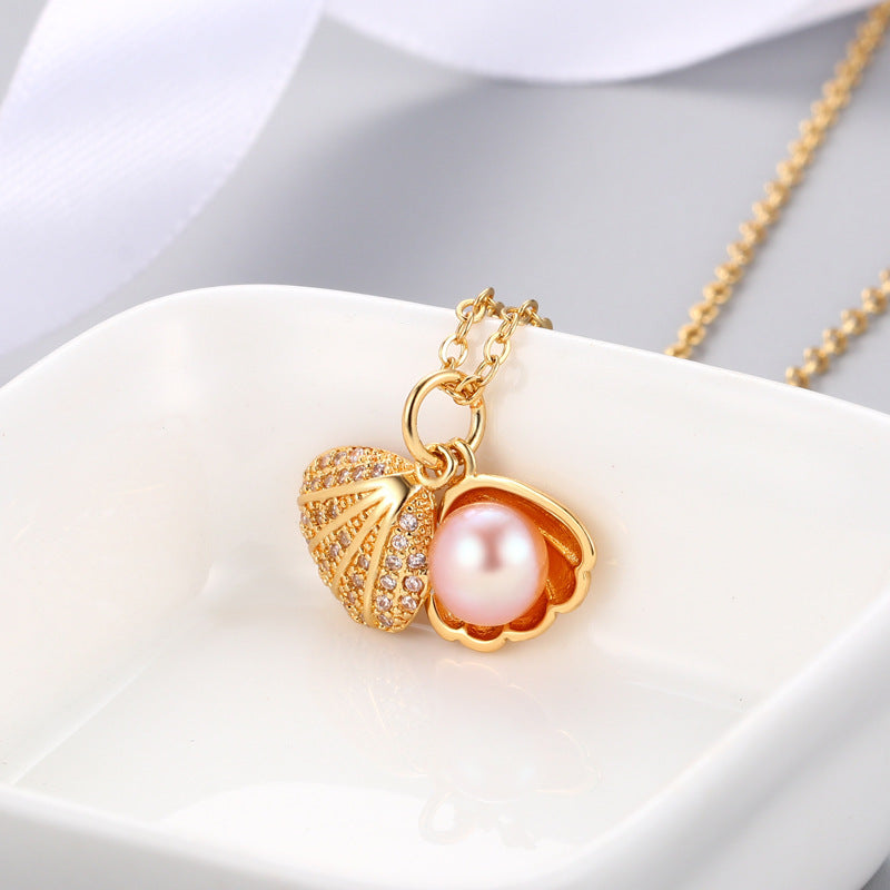 "Shell Freshwater Pearl Necklace β A delicate pendant featuring a 7-8mm freshwater pearl, available in various styles with white gold or gold supports. Elegant and timeless, perfect for adding sophistication to any occasion."