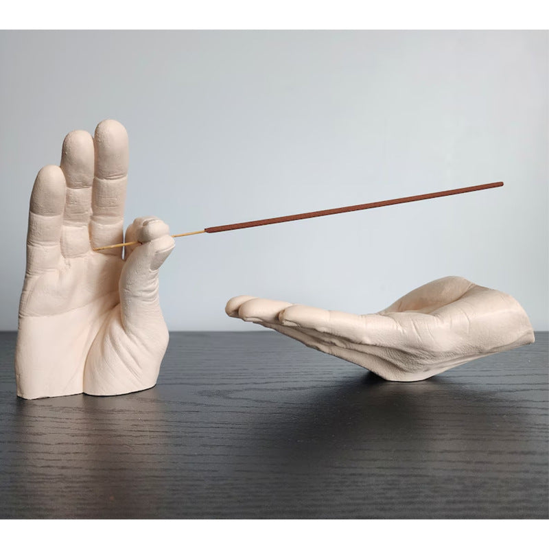 Cartoon-style resin incense holder in the shape of hands, available in black, white, light yellow, and brown. Made from synthetic resin, with a size of 19 * 10 * 10 cm, perfect for holding and receiving incense.