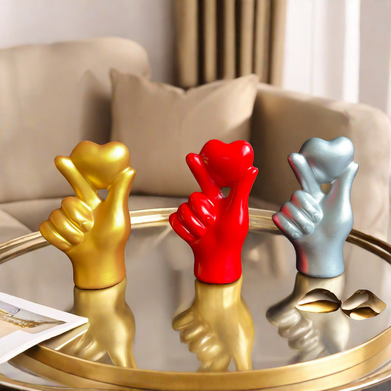 **Love Gesture Resin Ornament** – A beautifully crafted **resin decor piece** symbolizing love and warmth. Available in **red, gold, silver, and white**, it’s compact (**11 × 6.5 × 4 cm**) and perfect for any space. Ideal as a **gift or home accent**. 💖