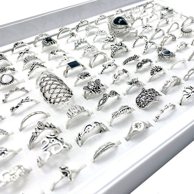 A stylish set of 100 fashion-forward silver alloy rings featuring geometric designs, perfect for adding a trendy touch to any outfit. Each set offers a random selection of styles, ensuring variety and versatility.