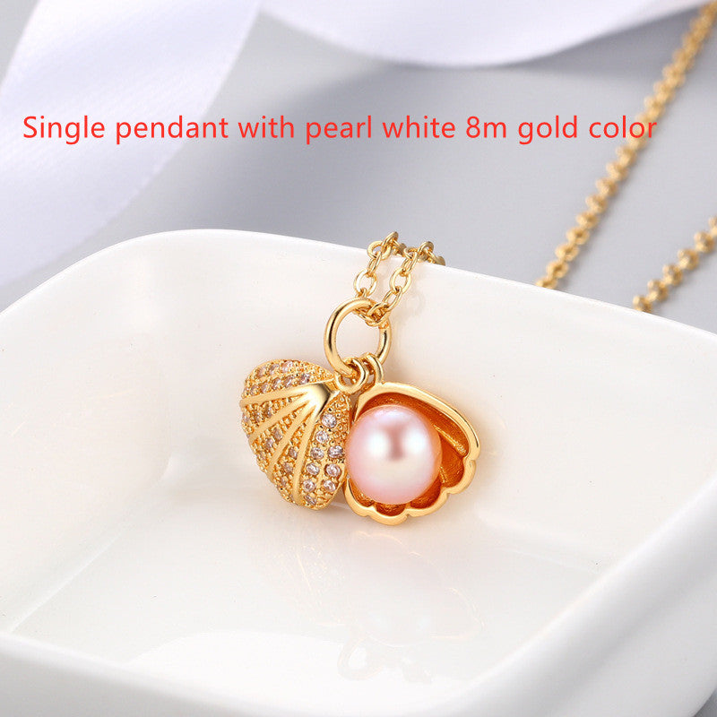 "Shell Freshwater Pearl Necklace β A delicate pendant featuring a 7-8mm freshwater pearl, available in various styles with white gold or gold supports. Elegant and timeless, perfect for adding sophistication to any occasion."