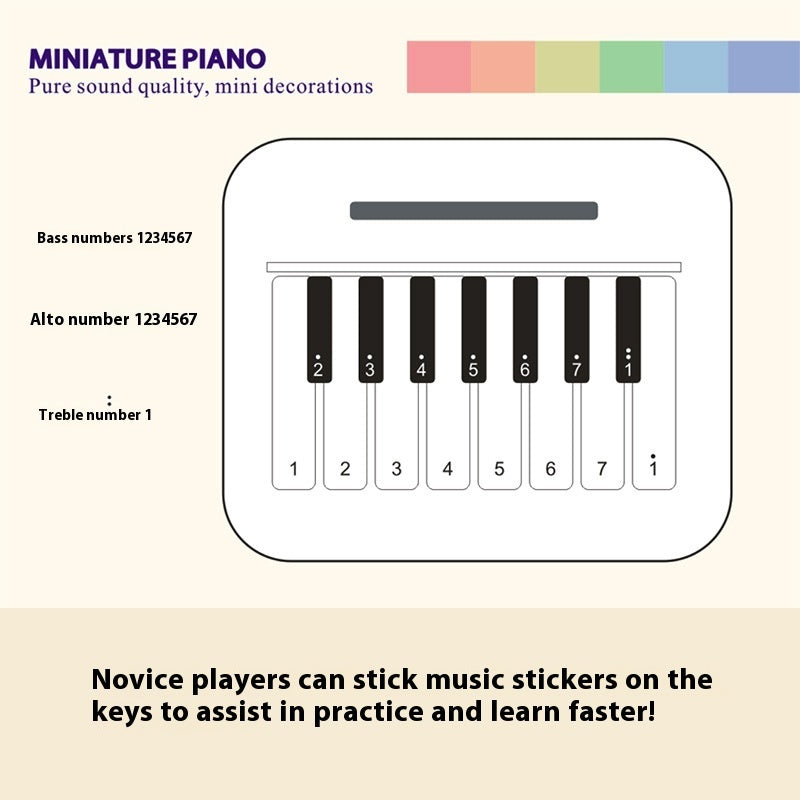 Mini retro-style piano toy in white or black, featuring 24 brief piano scores of world-famous pieces. Packaged in a gift box, perfect as a musical gift or decorative piece.