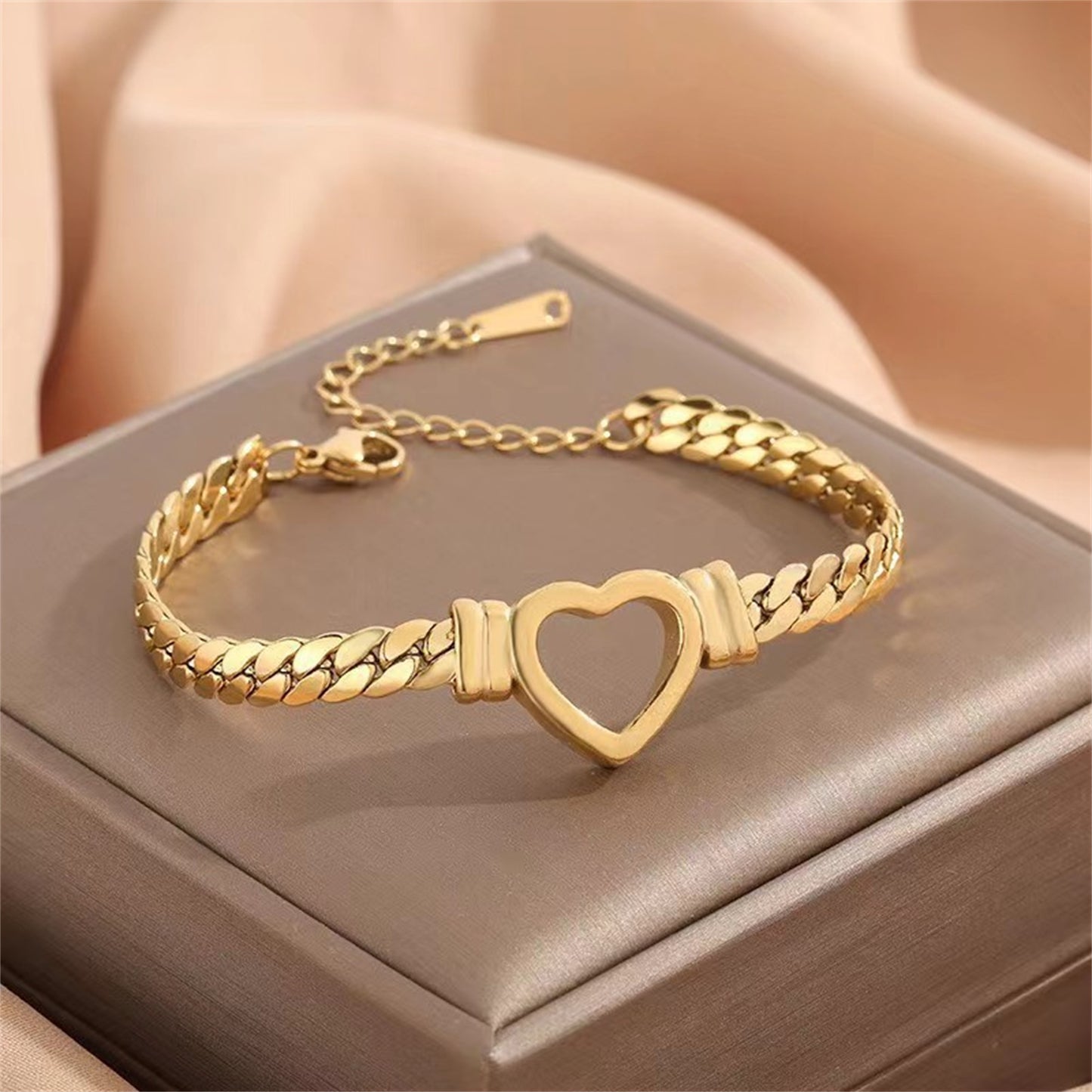 **Love Necklace & Bracelet** – Elegant **heart-shaped jewelry** with a sleek **Cuban chain**. Made from **stainless steel** with an **electroplated finish**, it's stylish, durable, and comfortable to wear. Perfect for any occasion or as a heartfelt gift. 💖