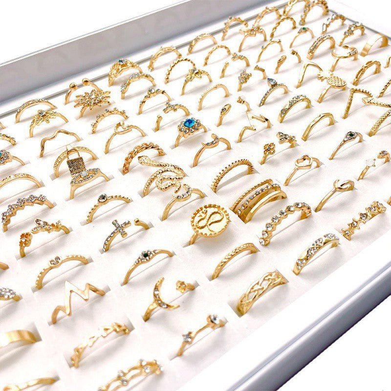A stylish set of 100 fashion-forward silver alloy rings featuring geometric designs, perfect for adding a trendy touch to any outfit. Each set offers a random selection of styles, ensuring variety and versatility.