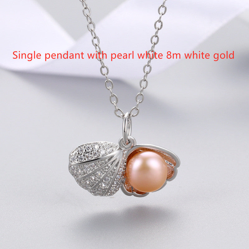 "Shell Freshwater Pearl Necklace β A delicate pendant featuring a 7-8mm freshwater pearl, available in various styles with white gold or gold supports. Elegant and timeless, perfect for adding sophistication to any occasion."