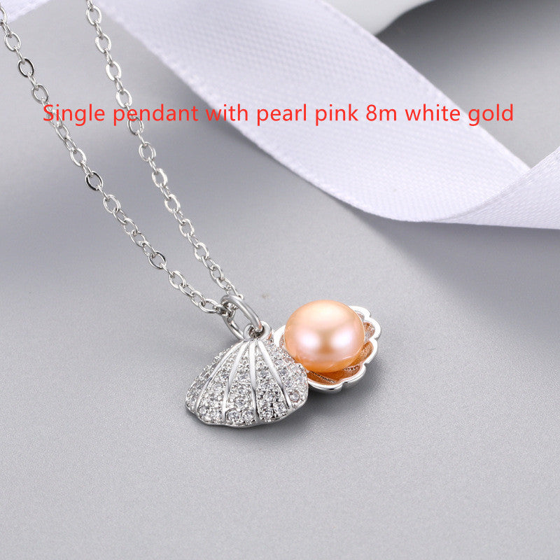 "Shell Freshwater Pearl Necklace β A delicate pendant featuring a 7-8mm freshwater pearl, available in various styles with white gold or gold supports. Elegant and timeless, perfect for adding sophistication to any occasion."