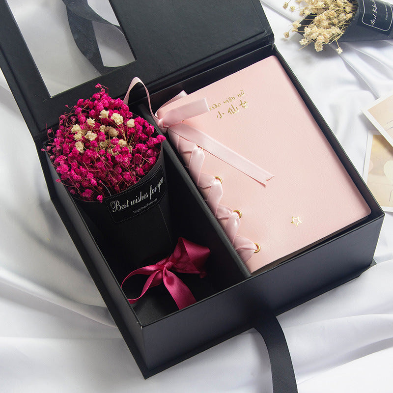 Elegant gift set with a variety of luxury items in a beautifully wrapped box.