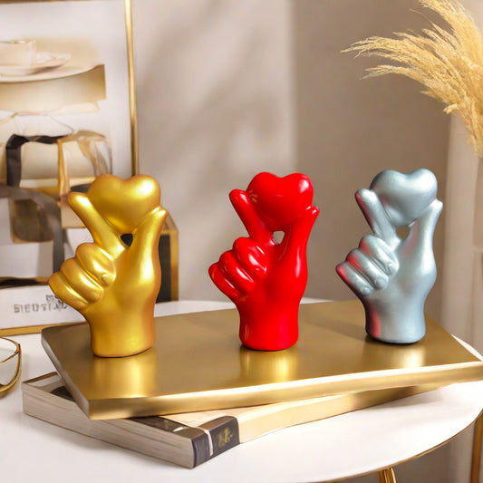 **Love Gesture Resin Ornament** – A beautifully crafted **resin decor piece** symbolizing love and warmth. Available in **red, gold, silver, and white**, it’s compact (**11 × 6.5 × 4 cm**) and perfect for any space. Ideal as a **gift or home accent**. 💖
