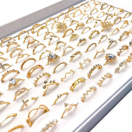 A stylish set of 100 fashion-forward silver alloy rings featuring geometric designs, perfect for adding a trendy touch to any outfit. Each set offers a random selection of styles, ensuring variety and versatility.