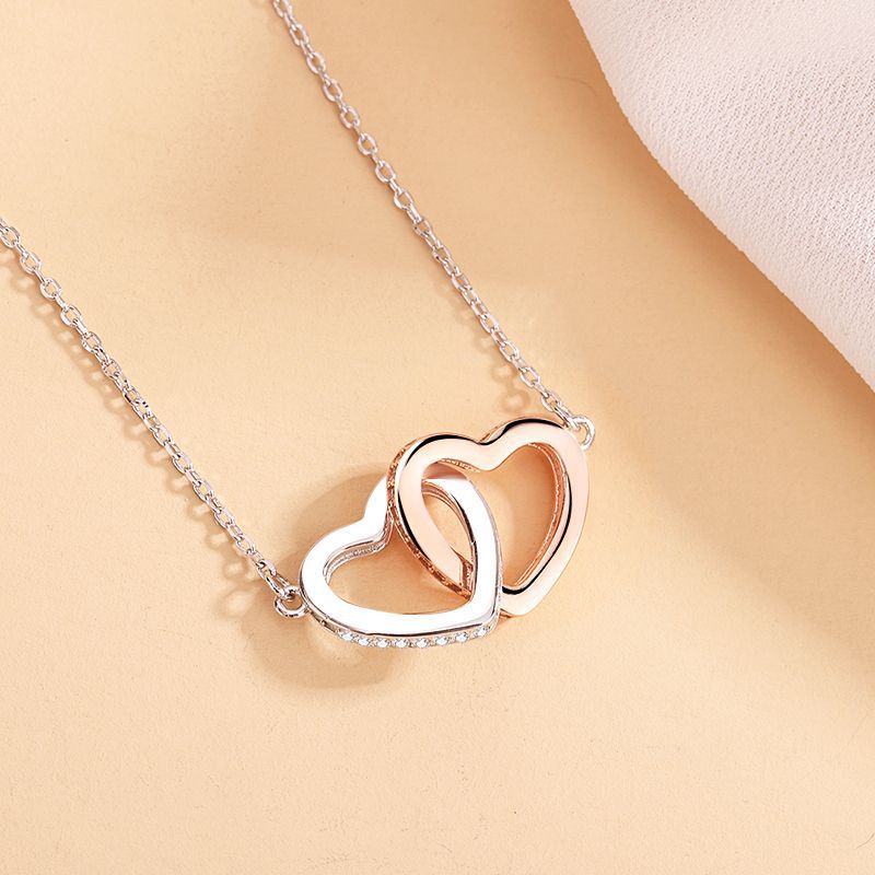 Elegant 925 silver heart necklace with cross chain, featuring double rings and heart pendant. Adjustable length for a perfect fit, a stylish and timeless accessory.