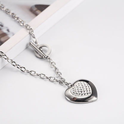 Heart-Shaped Rhinestone Jewelry Set made of titanium steel, featuring a necklace (45cm) and bracelet (20cm) with manual polishing. Available in steel color and gold.