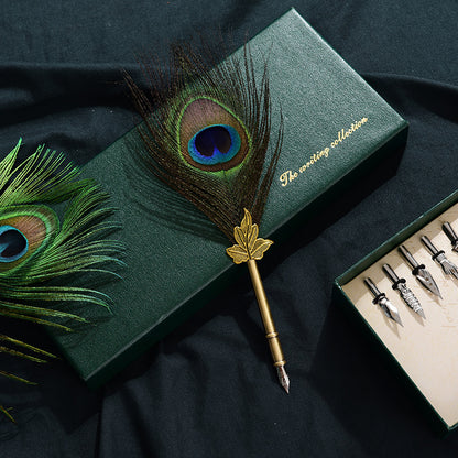 Retro Peacock Feather Pen Set featuring a 25cm feather pen, ink bottle, base with double-sided adhesive, and 5 replacement nibs, all packaged in a sleek 29 * 11.5 * 4CM box.