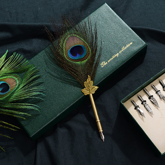Retro Peacock Feather Pen Set featuring a 25cm feather pen, ink bottle, base with double-sided adhesive, and 5 replacement nibs, all packaged in a sleek 29 * 11.5 * 4CM box.