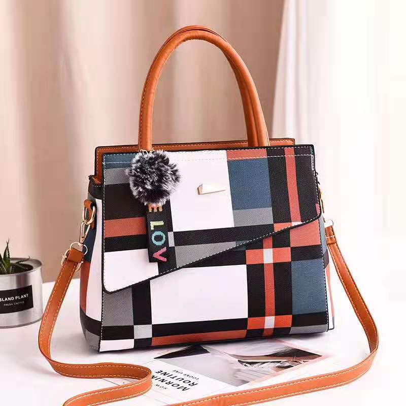 Stylish ladies one shoulder bag in two sizes (small and large), featuring a sleek design with a portable handle. Perfect for carrying essentials with a modern, elegant touch.