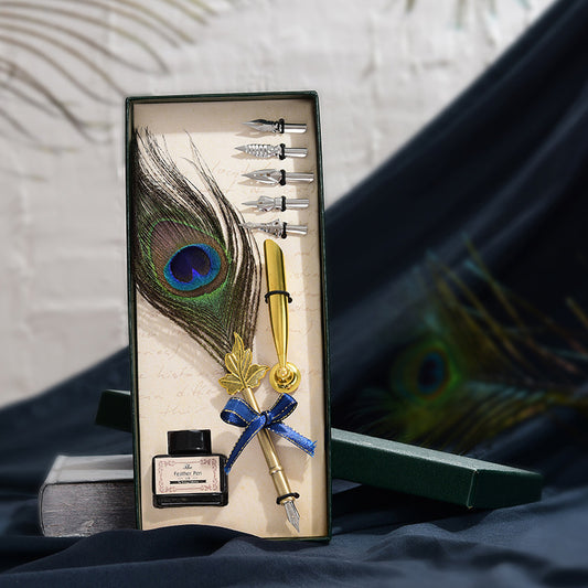 Retro Peacock Feather Pen Set featuring a 25cm feather pen, ink bottle, base with double-sided adhesive, and 5 replacement nibs, all packaged in a sleek 29 * 11.5 * 4CM box.