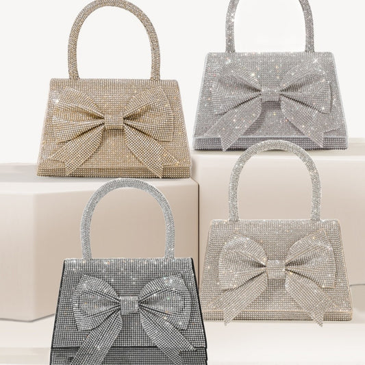 Step into the world of luxury and sophistication with the Elegant Full-Diamond Bow Handbag, a true statement piece that combines timeless elegance with a modern edge. Designed for the fashion-forward, this handbag is a stunning blend of street trend and light luxury style.