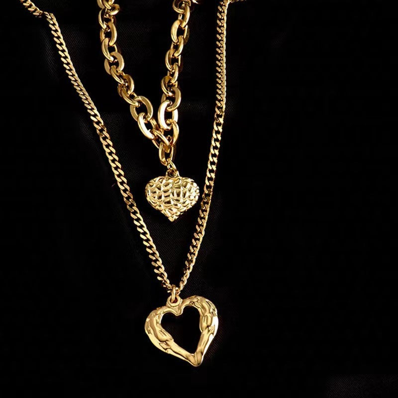 **Love Necklace Gift Set – Stylish & Elegant**  

A beautiful **2-piece necklace set** featuring **heart-shaped** and **geometric pendants** made from **high-quality titanium steel**. Available in **silver** and **golden** colors, with **gold inlaid treatment** for a luxurious finish. The **O-shaped chain** adds comfort and style, perfect for women who love elegant, **Korean-style** accessories.