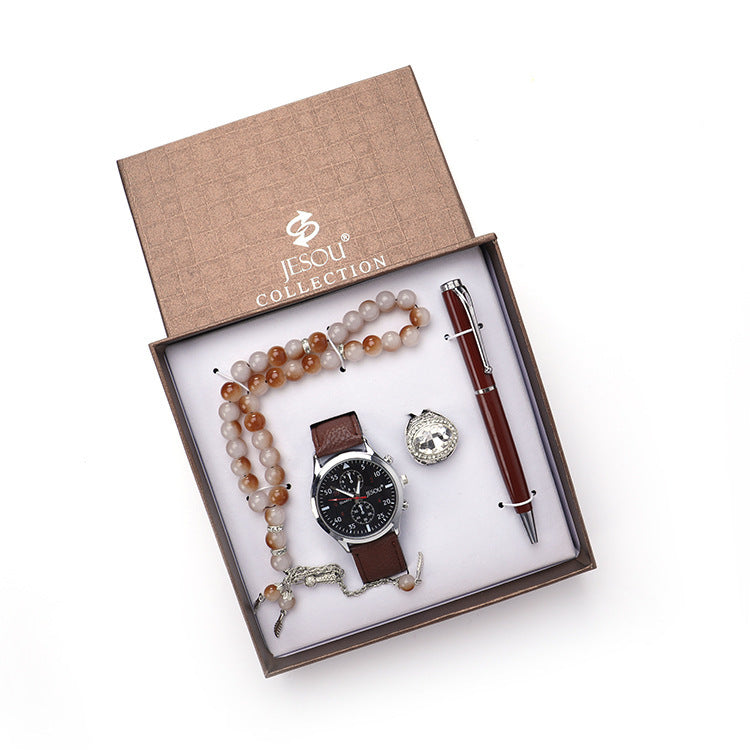 A chic boutique gift set featuring a stylish watch, a rosary, a ring, and a sleek pen, all presented in elegant black and brown color options.